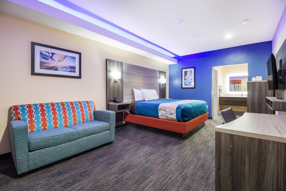 Unwind in a spacious room with cozy seating and glow.