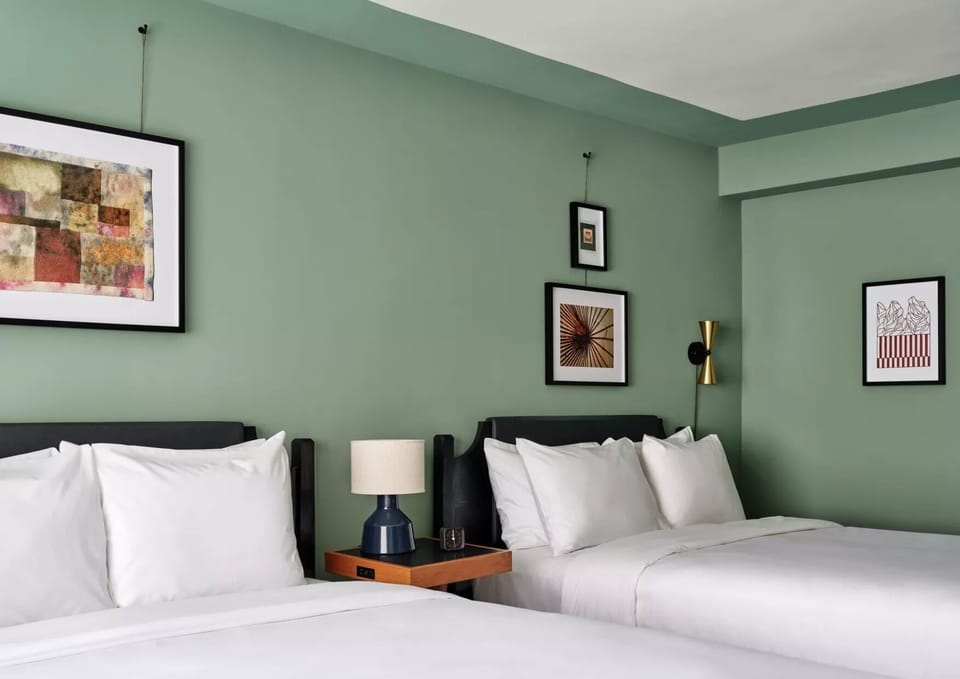 Sink into crisp linens and enjoy a calm, modern retreat.