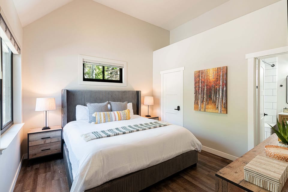 Unit 1 main level bedroom 3 with a king bed