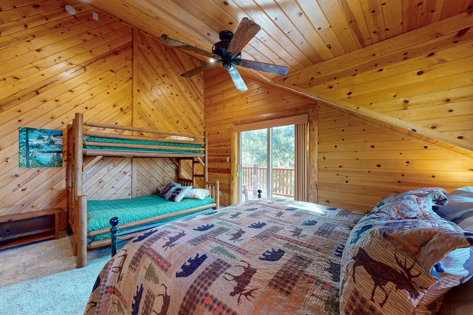 Family‑friendly bedroom with bunk beds, cozy décor, and inviting layout perfect for shared stays.