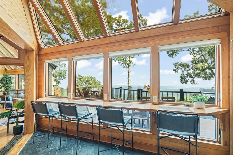 Kitchen area has additional bar seating for 8