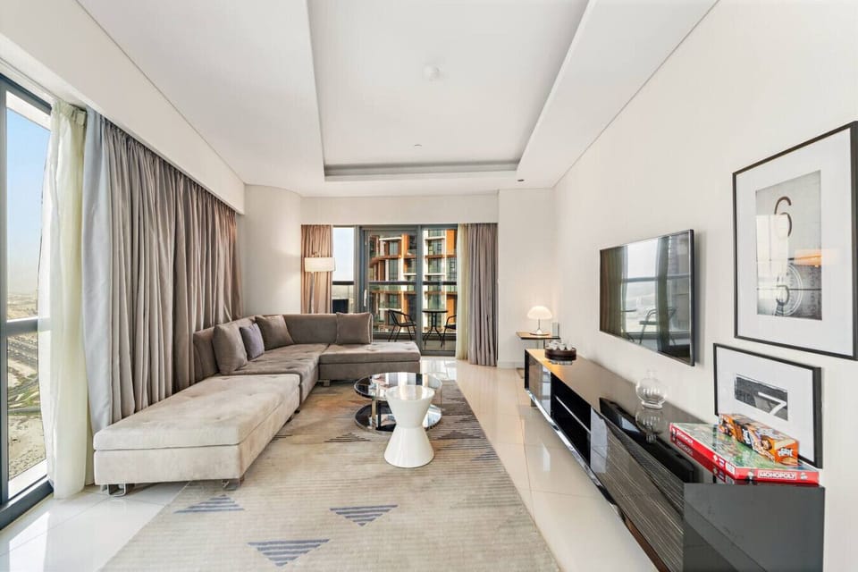 Living Room: Sun-drenched space with sleek decor and stunning city views. Perfect for relaxation!