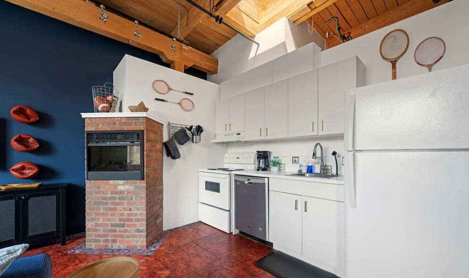 Whip up your favorite meals in this full kitchen with modern appliances, cookware, and unique vintage touches. Ideal for short or extended stays!