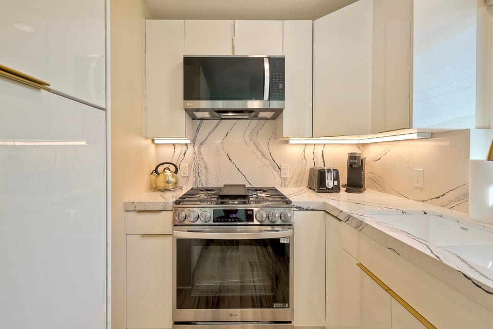 Sleek kitchen with stainless appliances