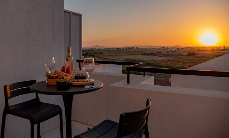 Upstairs bedroom opens to a stunning roof veranda with a bar table—perfect for enjoying breathtaking views in style.
