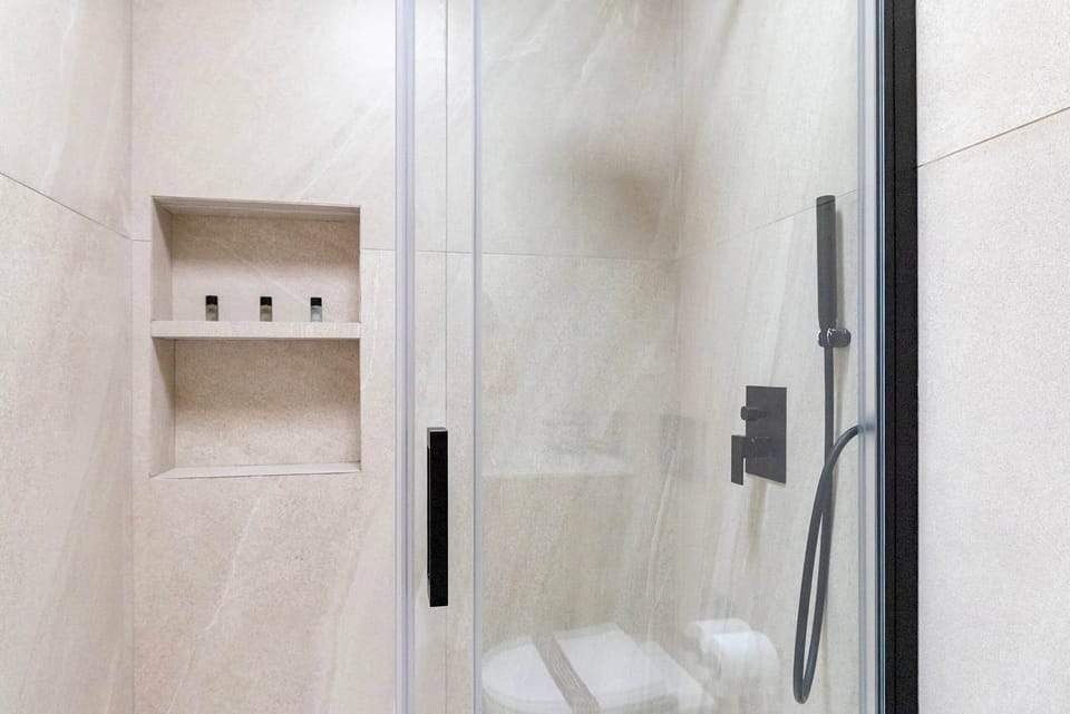 Spacious shower with luxurious fixtures