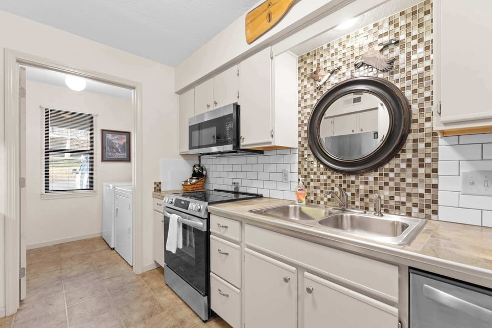 The open, airy kitchen offers ample space & every home comfort​