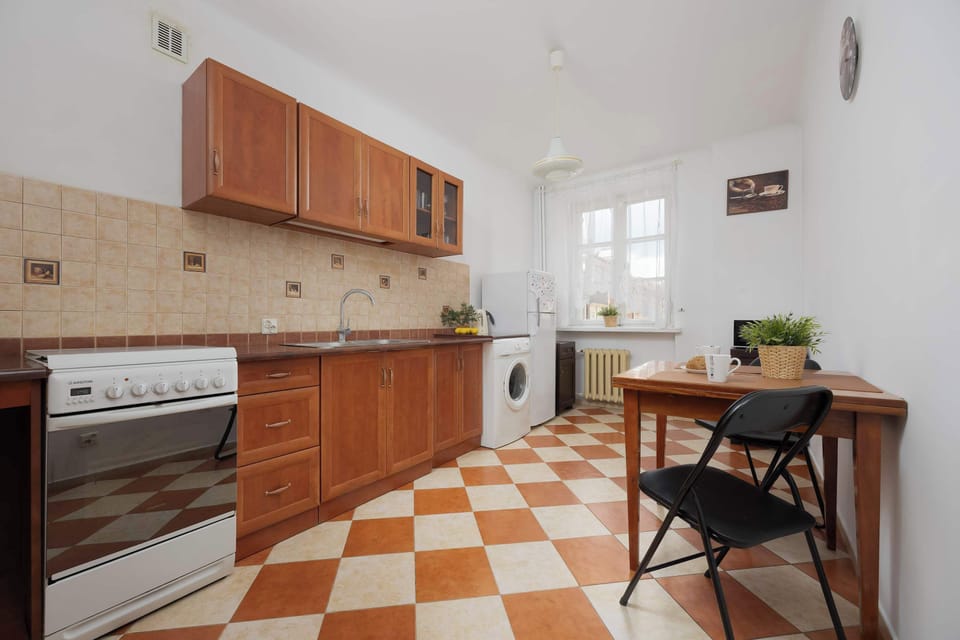 A functional and charming kitchen with ample countertop space, and a cozy table perfect for morning coffee or quick meals.