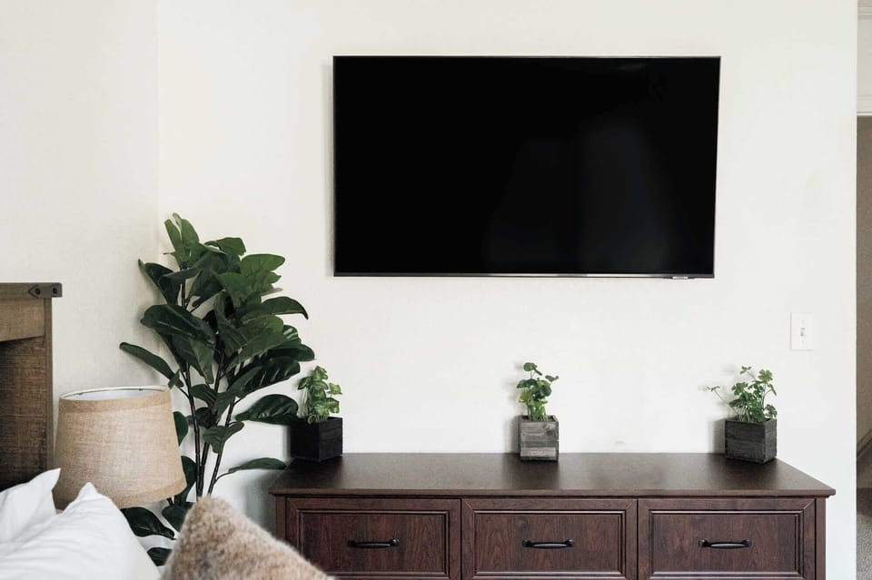 Primary bedroom with smart TV plus a full, private ensuite bathroom