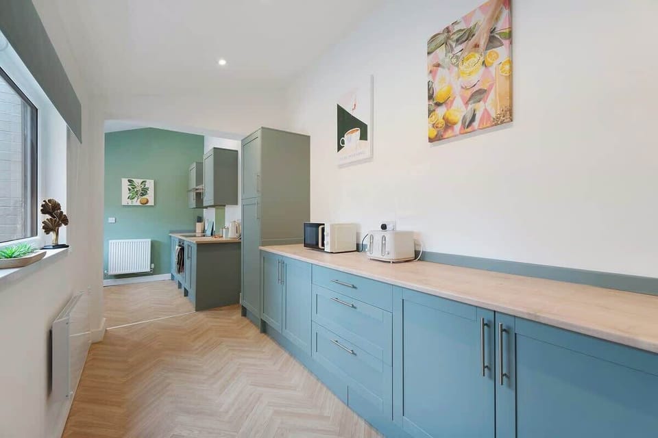 Kitchen equipped with all essentials, including a washer & dryer, oven, fridge and full cookware set.