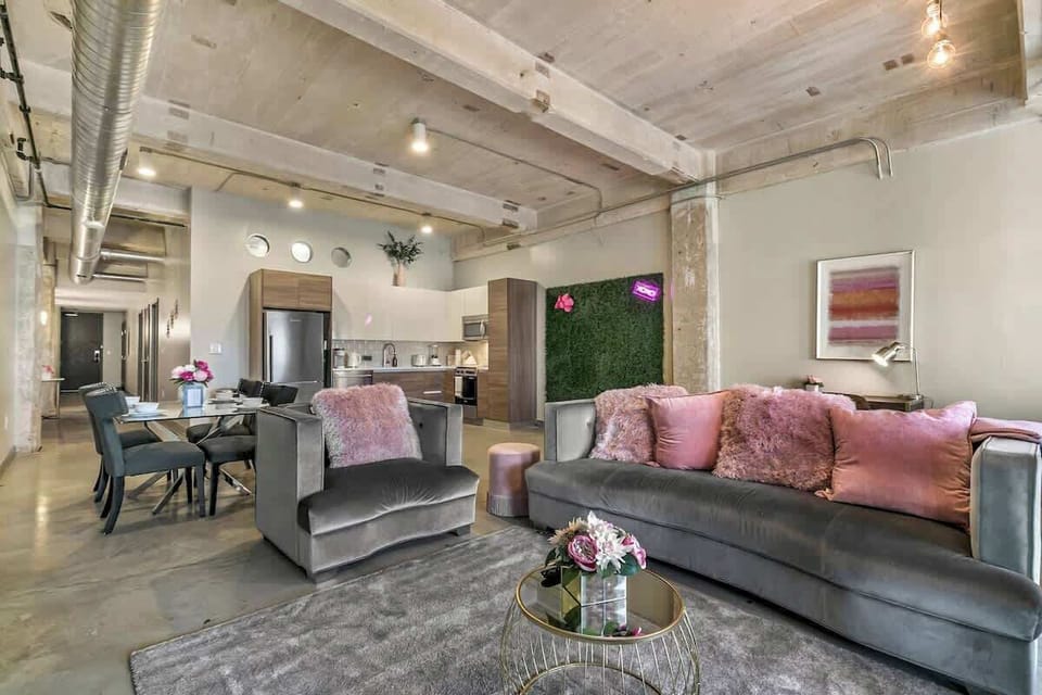 Chic urban oasis with plush seating and vibrant decor—perfect for gathering and relaxation