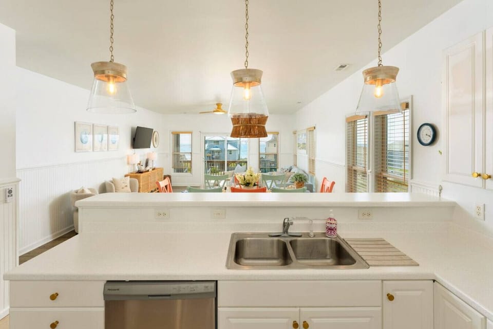 Family-friendly Topsail Beach kitchen and dining space with ocean-view seating.