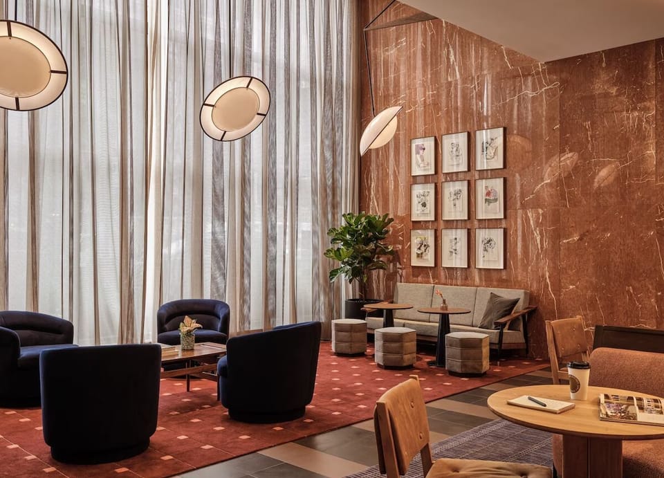 Gather and relax in the airy lobby with designer seating.