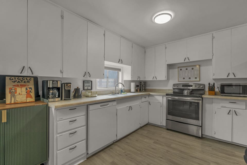 Light and bright kitchen with all of the appliances