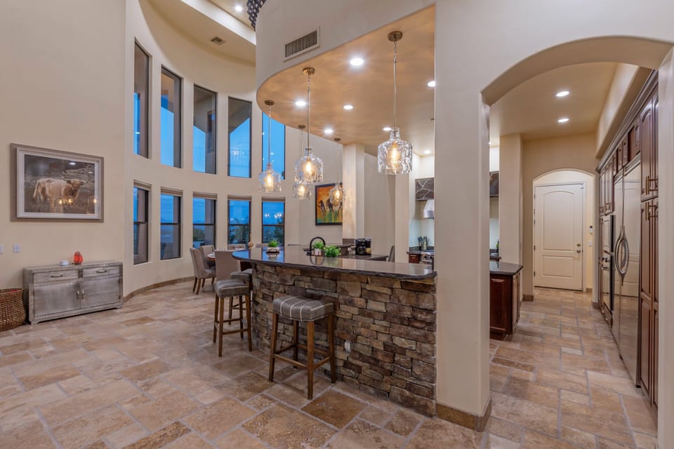 Large windows add natural light to enhance home's ambiance.