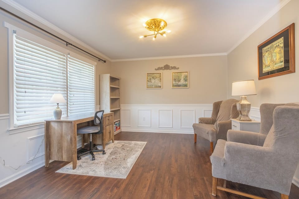 View from formal dining room into the office/study.  Books and games on shelves