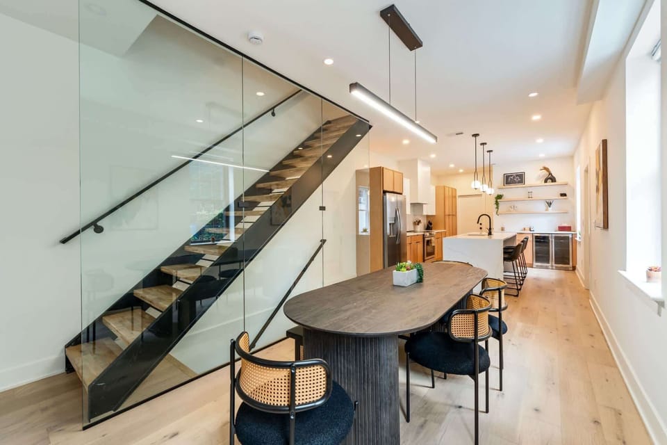 Glass encased stairwell to the upstairs bedrooms and bathrooms or to the speakeasy downstairs.
