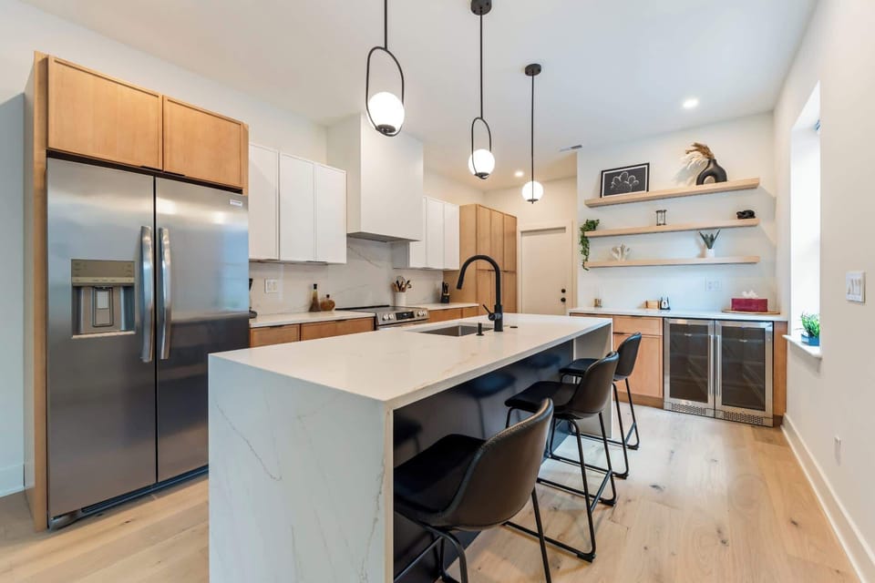 Extra seating and a spacious kitchen. Wine fridge large range with enclosed exhaust fan.