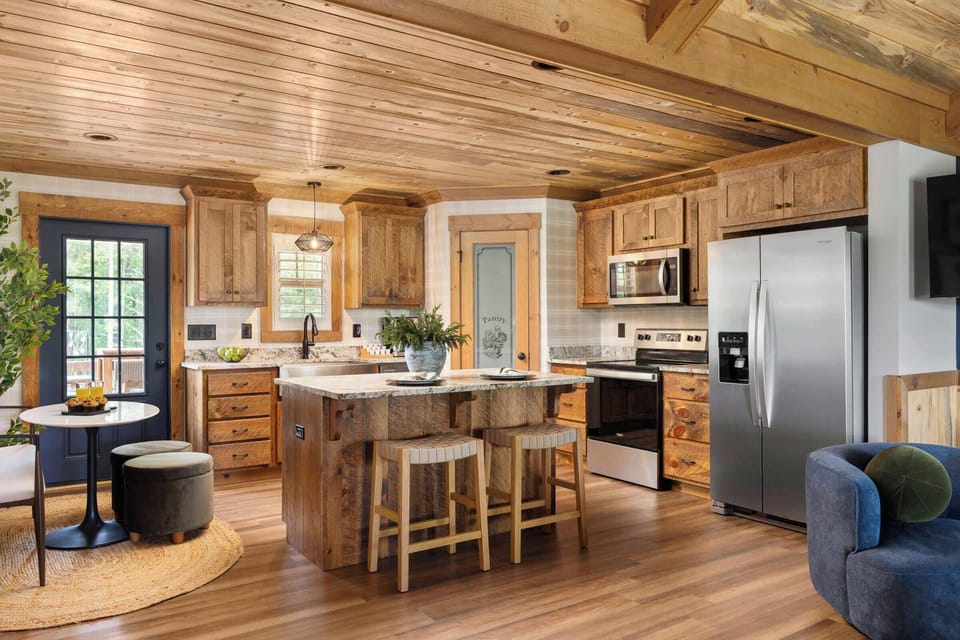 Enjoy cooking in our fully stocked kitchen, complete with premium appliances and a spacious island with bar seating—perfect for casual meals or morning coffee.

