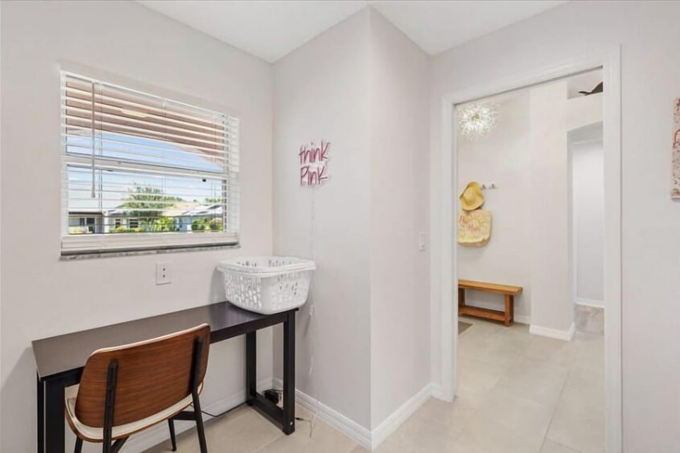 Laundry room with writing desk