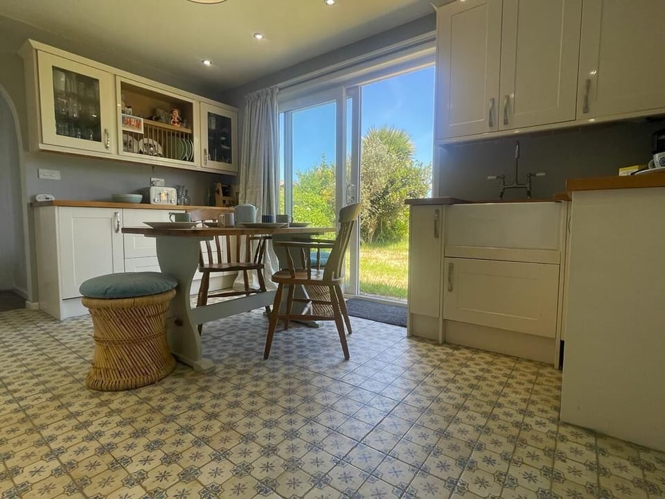 Kitchen with patio doors leading to the garden 