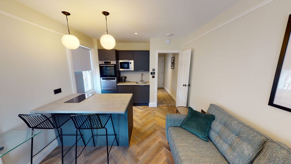This bright open-plan studio features a comfortable double bed, a sofa bed, Smart TV with Netflix, a private kitchenette, and a breakfast bar—all with fresh bedding and towels provided for every guest.
