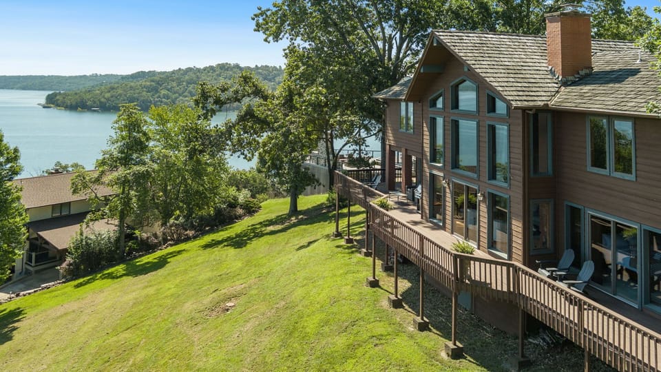  Our beautiful home, located on Beaver Lake, offers a serene view of the water from the huge patio or the comfort of the living room.