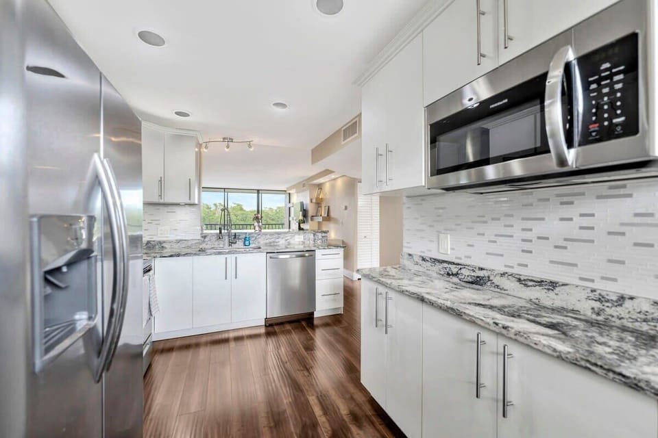 Chef's kiss! Modern amenities meet bright, beautiful design in this culinary dream