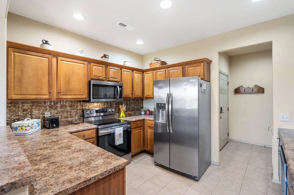 The open kitchen offers ample space & all the comforts of home​
