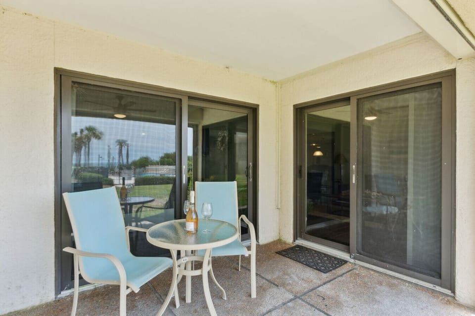 Covered back patio off living room and bedroom