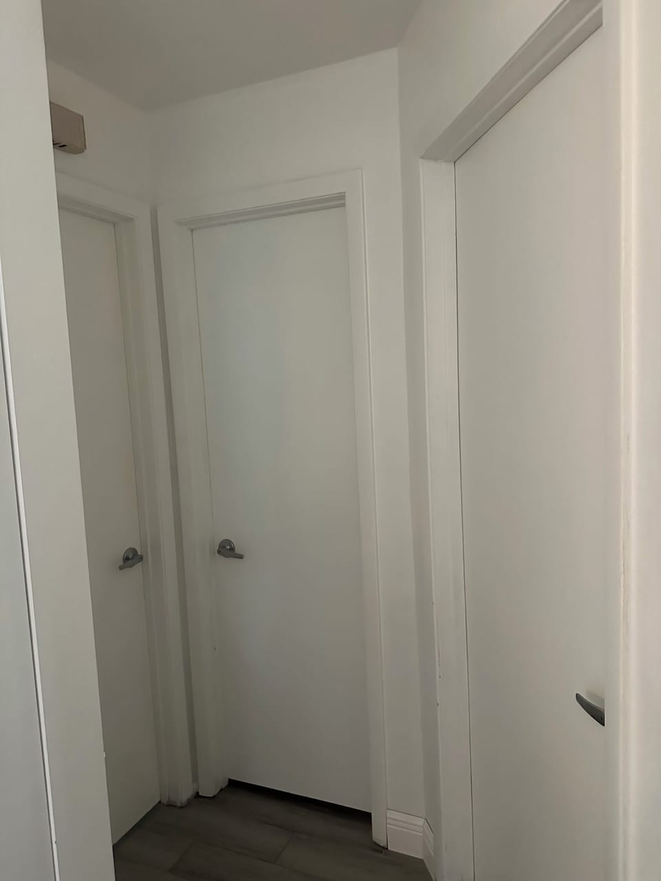 First bedroom, half bathroom second bedroom door