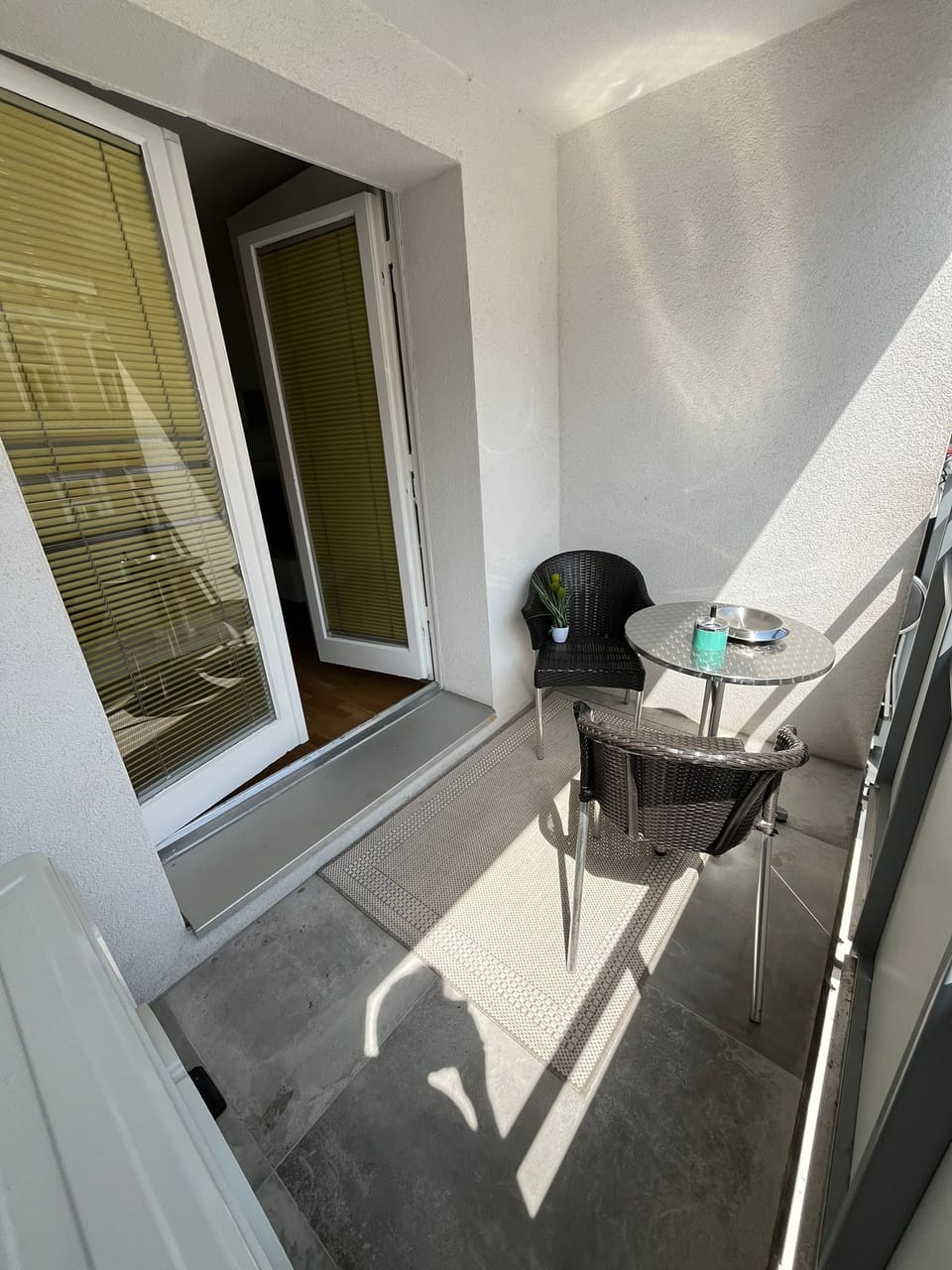 Sip, sit, and unwind – this balcony is your personal outdoor lounge.