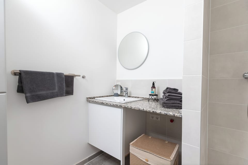 Immaculate private bathroom stocked with essentials.
