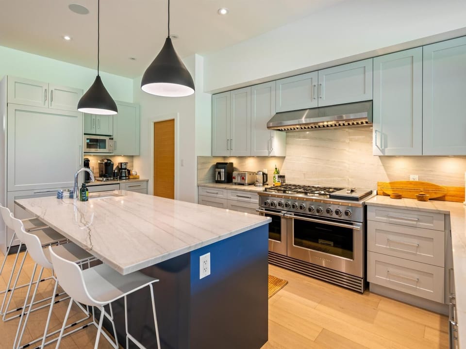 Modern, thoughtfully designed kitchen with gas range
