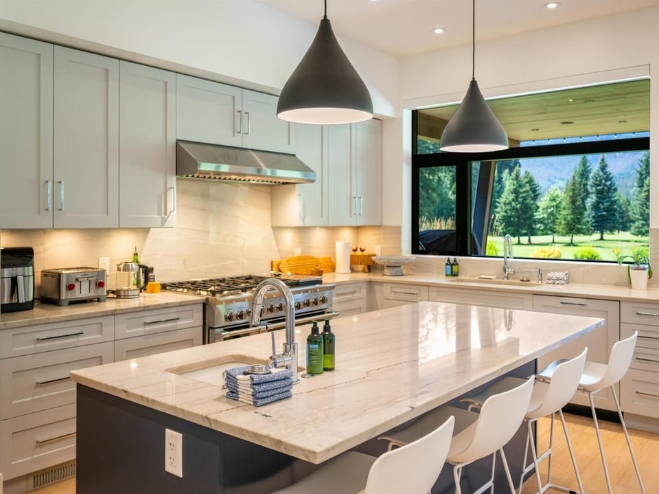 Bright and modern kitchen is fully-loaded with everything that you will need throughout your stay