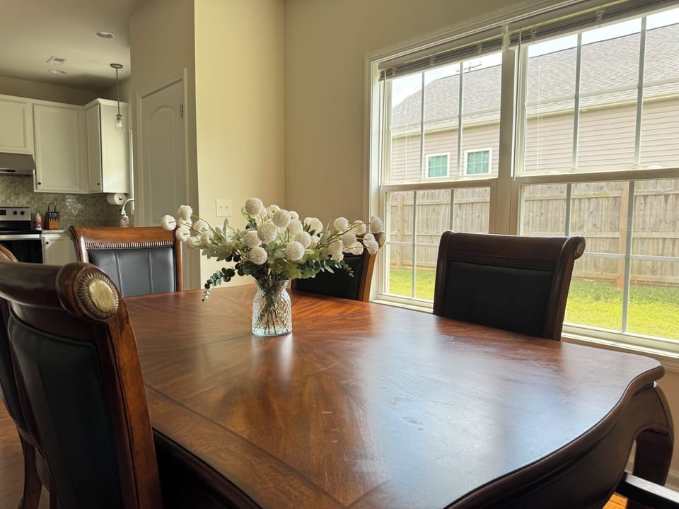 Table for 6 with 2 additional chairs and table sections. 
