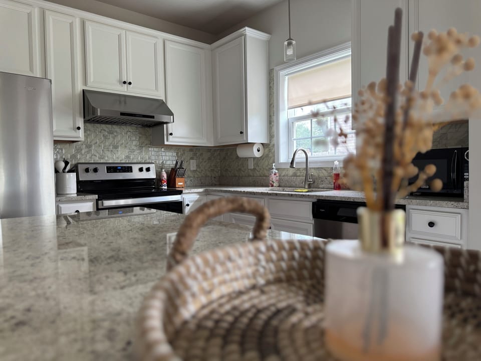 Stocked kitchen with necessary appliances
