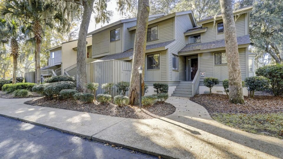 Arrive to a quiet, tree-lined retreat with easy access.