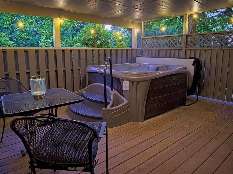 The covered pergola keeps the rain off while the jets stay on. There's a reason guests keep coming back.