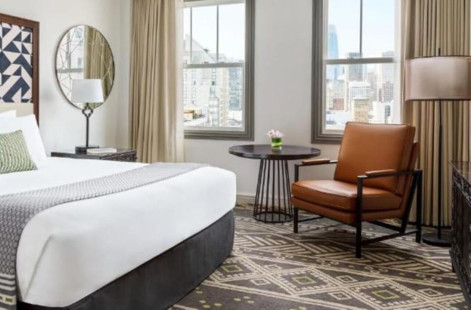Sip morning coffee by the window with cozy seating.