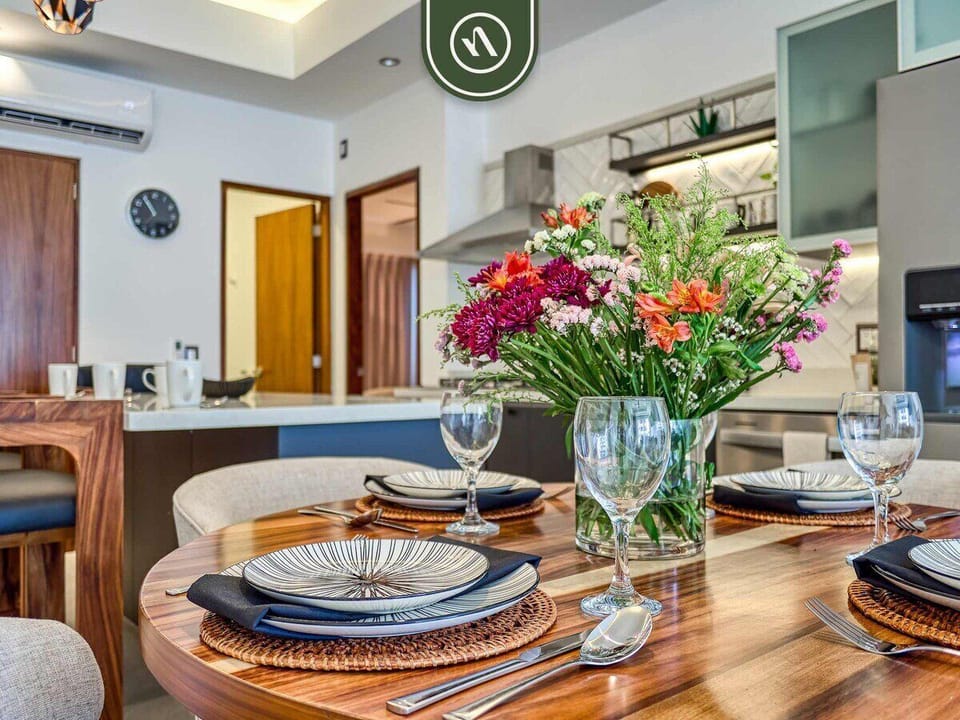 Dining Area
Elegant dining space with a round table and designer lighting, perfect for shared meals and cozy gatherings.
