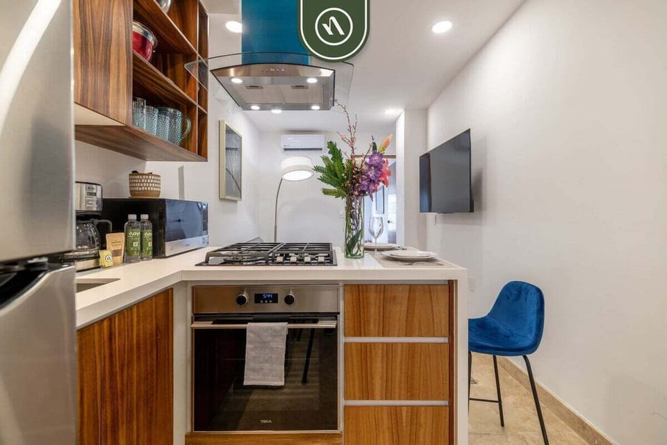 This compact yet highly functional kitchen features premium wood cabinetry and modern stainless steel appliances. With a gas range and built-in oven, you have everything needed to prepare delicious home-cooked meals during your stay.