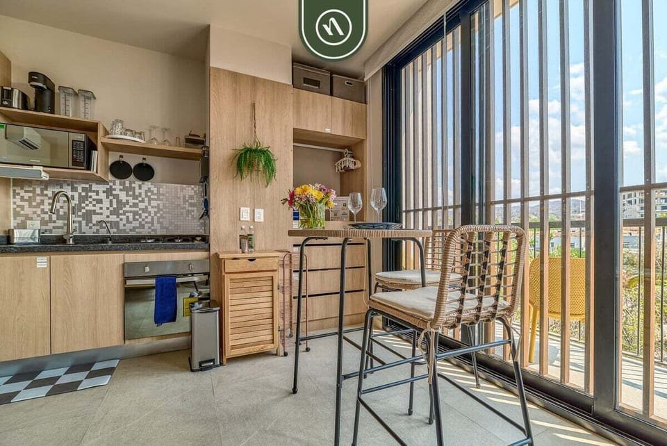 Enjoy meals or remote work in this inviting dining space, seamlessly connected to the fully equipped kitchen and balcony.