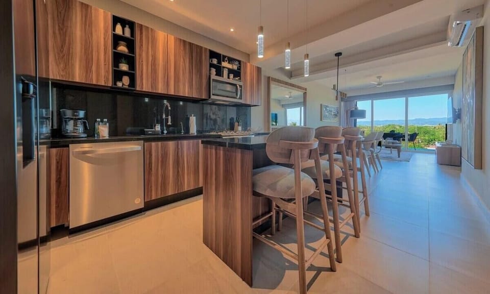 Fully equipped kitchen with granite countertops and premium appliances.