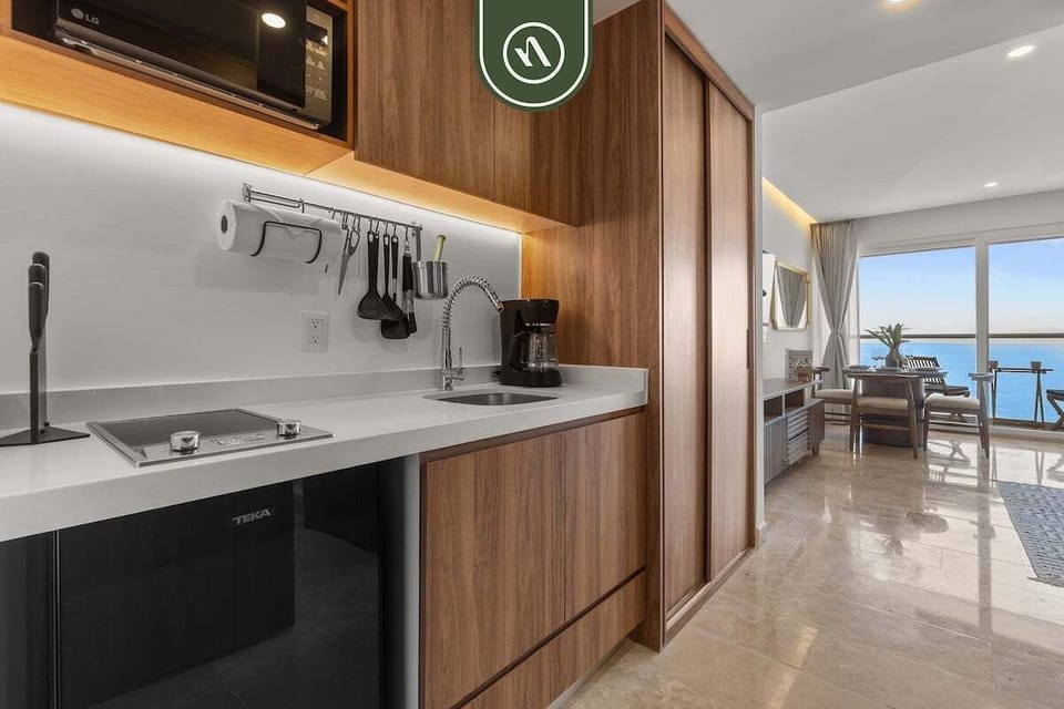 Modern kitchenette with contemporary finishes and smart layout, offering everything needed for light meals and added convenience during your stay.
