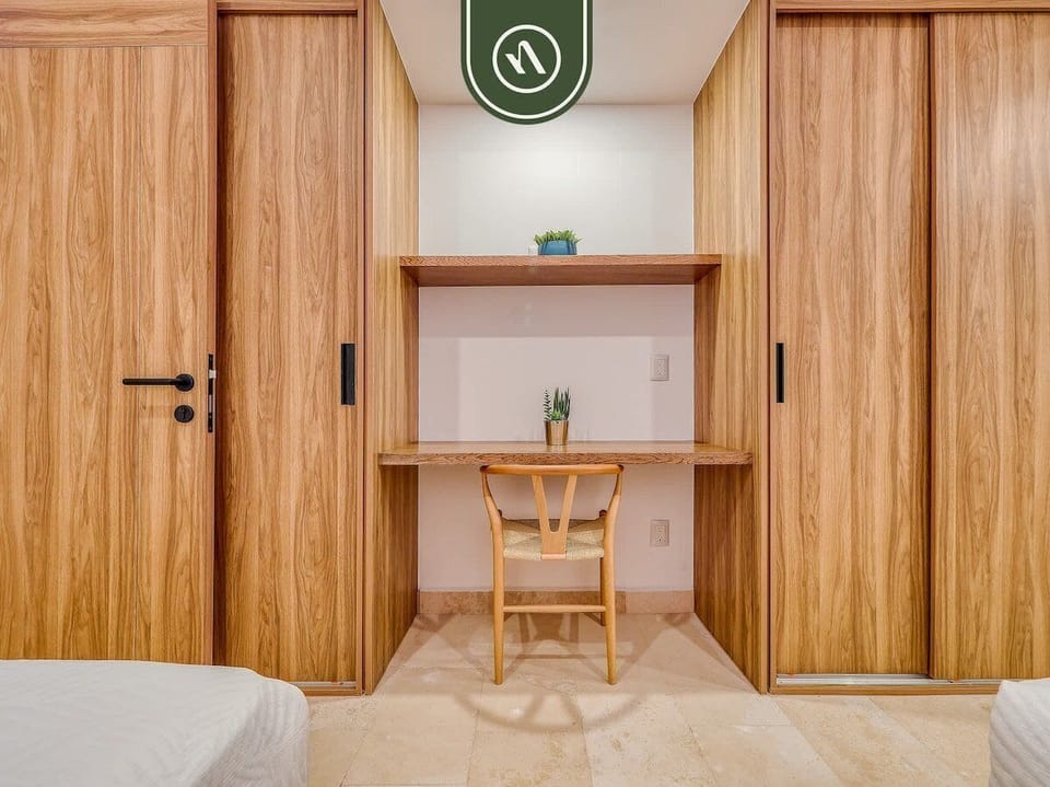 Convenient built-in workspace with desk and shelving, surrounded by spacious closet storage. Ideal for remote work, planning adventures, or staying organized during your Puerto Vallarta getaway.