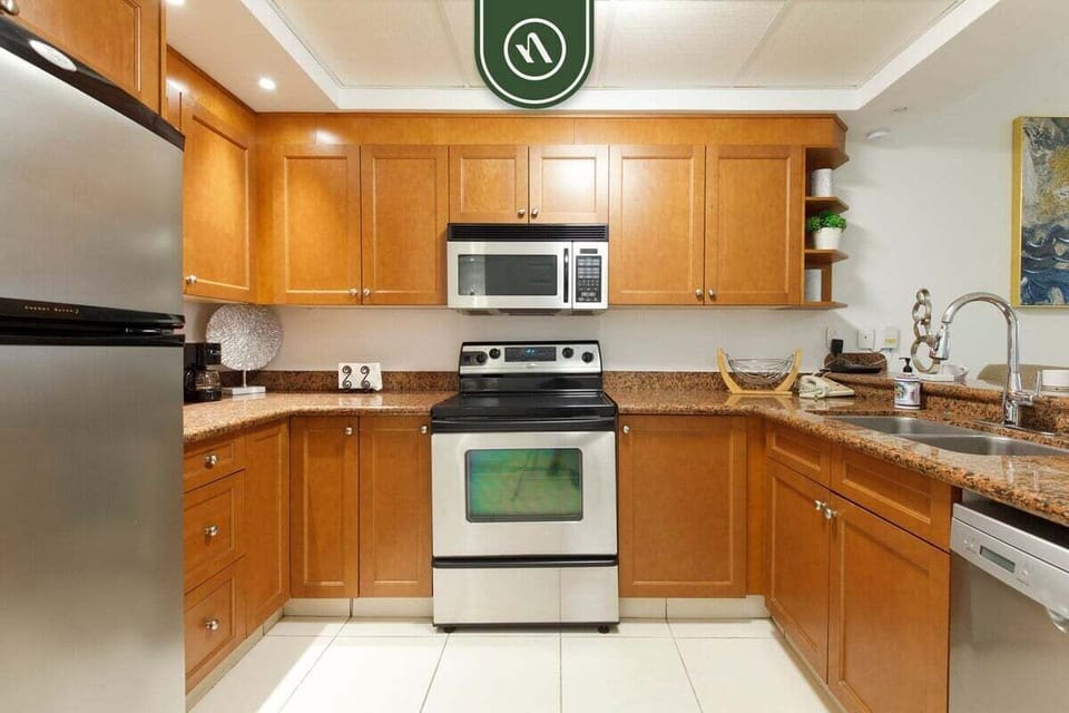 Featuring stainless steel appliances, granite countertops, and ample cabinetry, this kitchen has everything you need for extended stays.