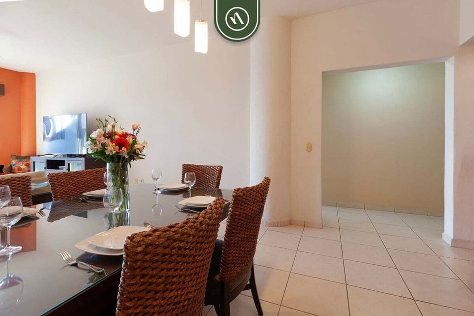 The thoughtfully designed layout connects the dining area, living room, and kitchen, creating an ideal space for entertaining and relaxing.