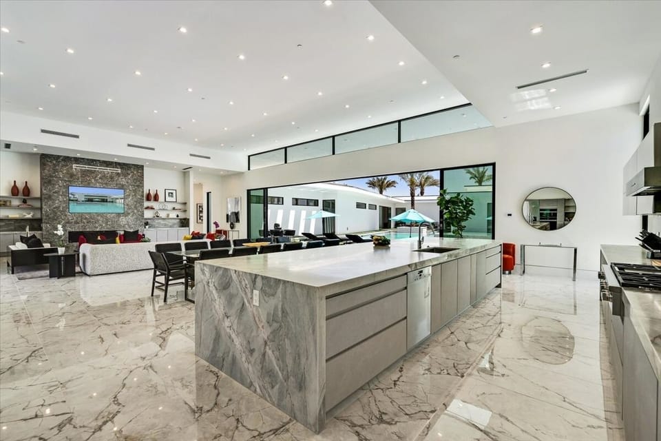 Chef’s kitchen with Miele appliances and imported finishes.