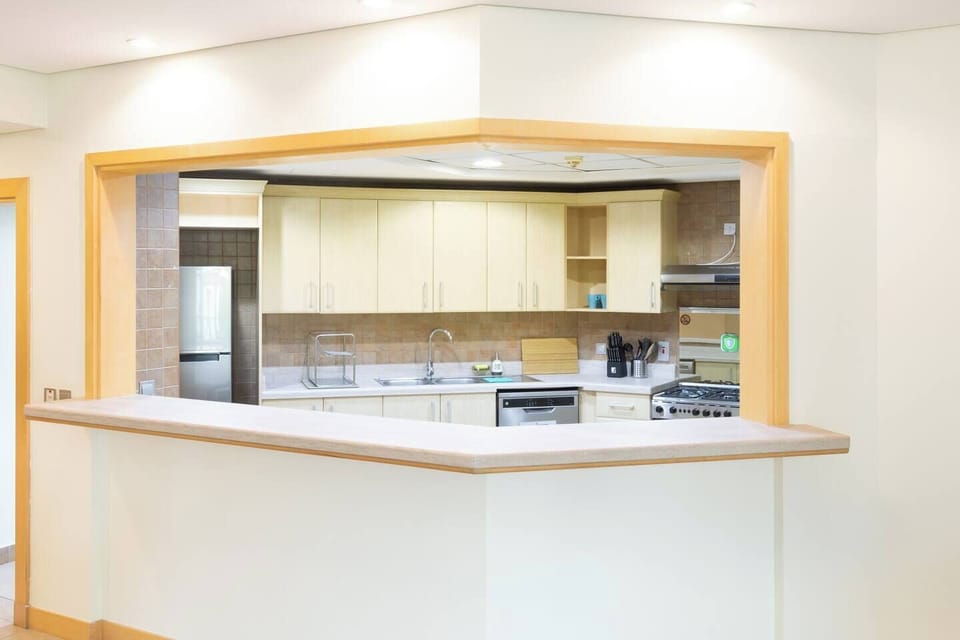 This kitchen counter space is both a practical workstation and a central gathering spot.